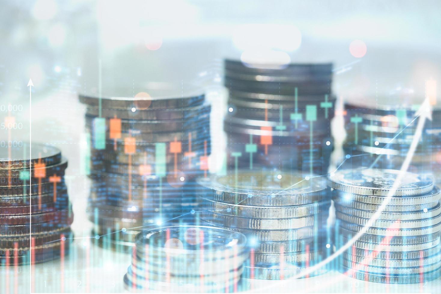 Double exposure Stock market investment trading financial coins with graph on virtual screen. Business saving money accounting economy concept. photo