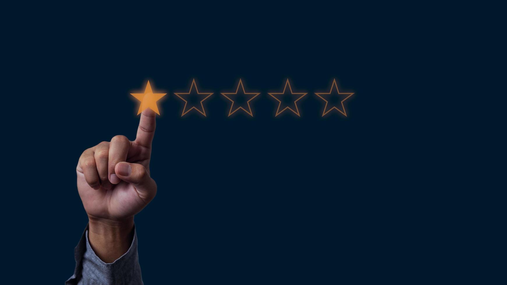 Businessman hand touches five stars rating feedback rating and positive customer review experience on virtual screen. photo