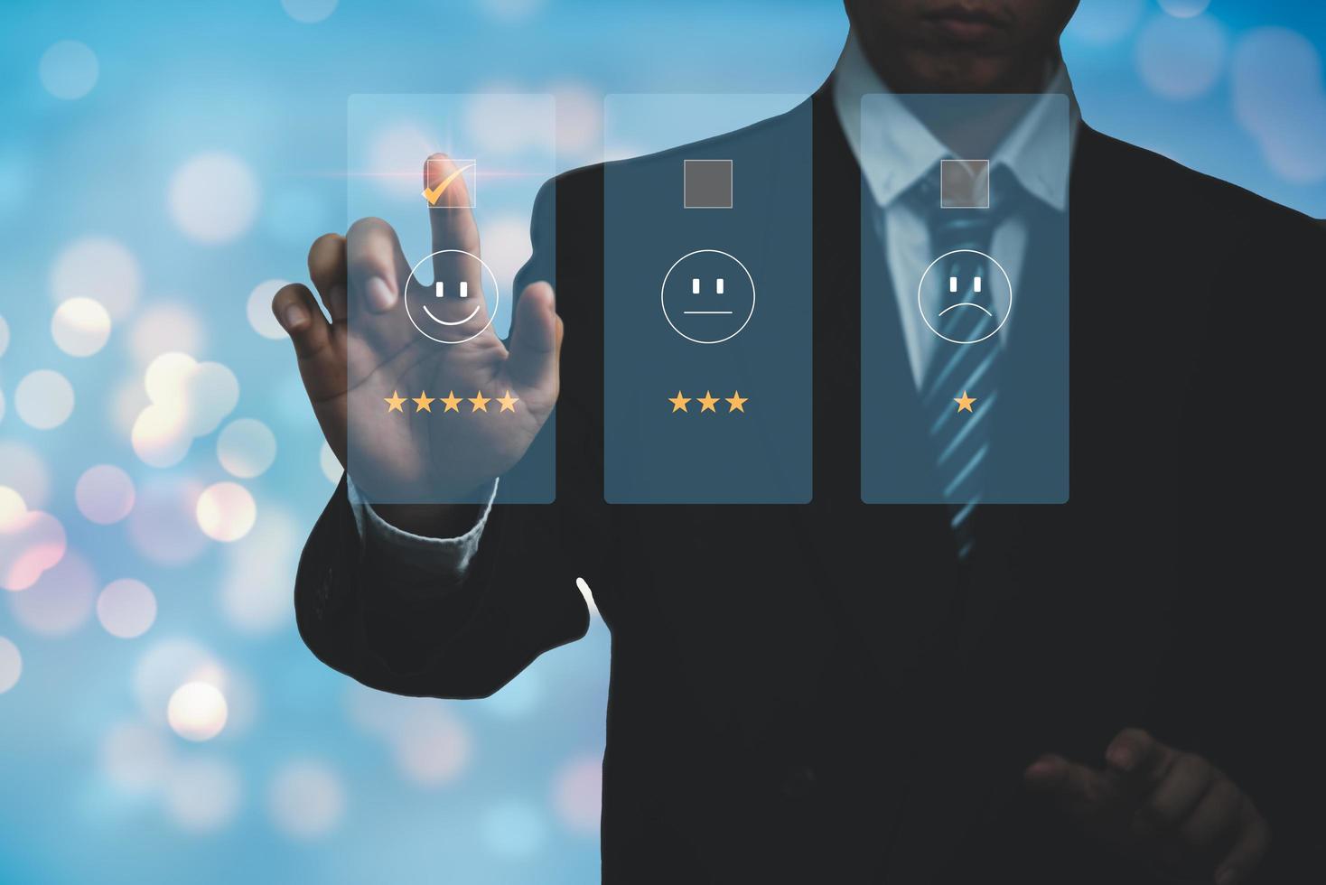 Business satisfaction survey customer service experience concept.Happy Businessman choose to rating checked box on Excellent Smiley Face Rating for a Satisfaction Survey. photo