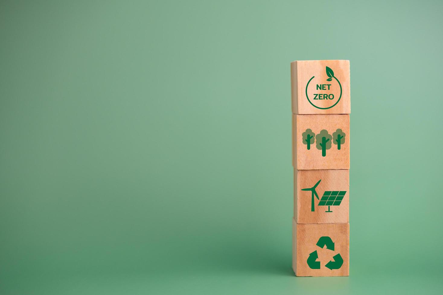 Net zero green technology innovation eco carbon renewable energy business concept with wood cube blocks. photo