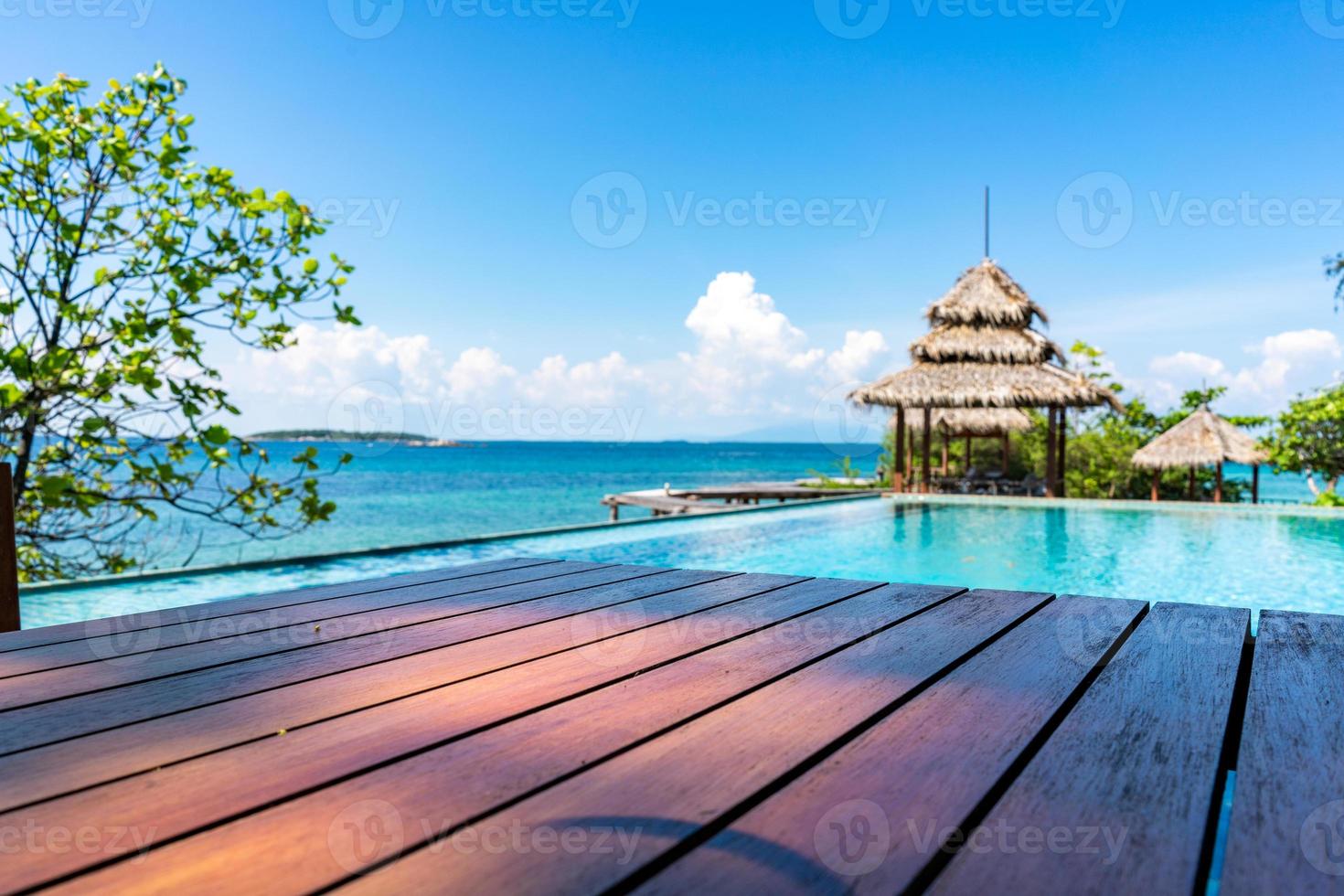 Wood Vintage Terrace on the beach with blue Sea, Ocean, Sky Background photo