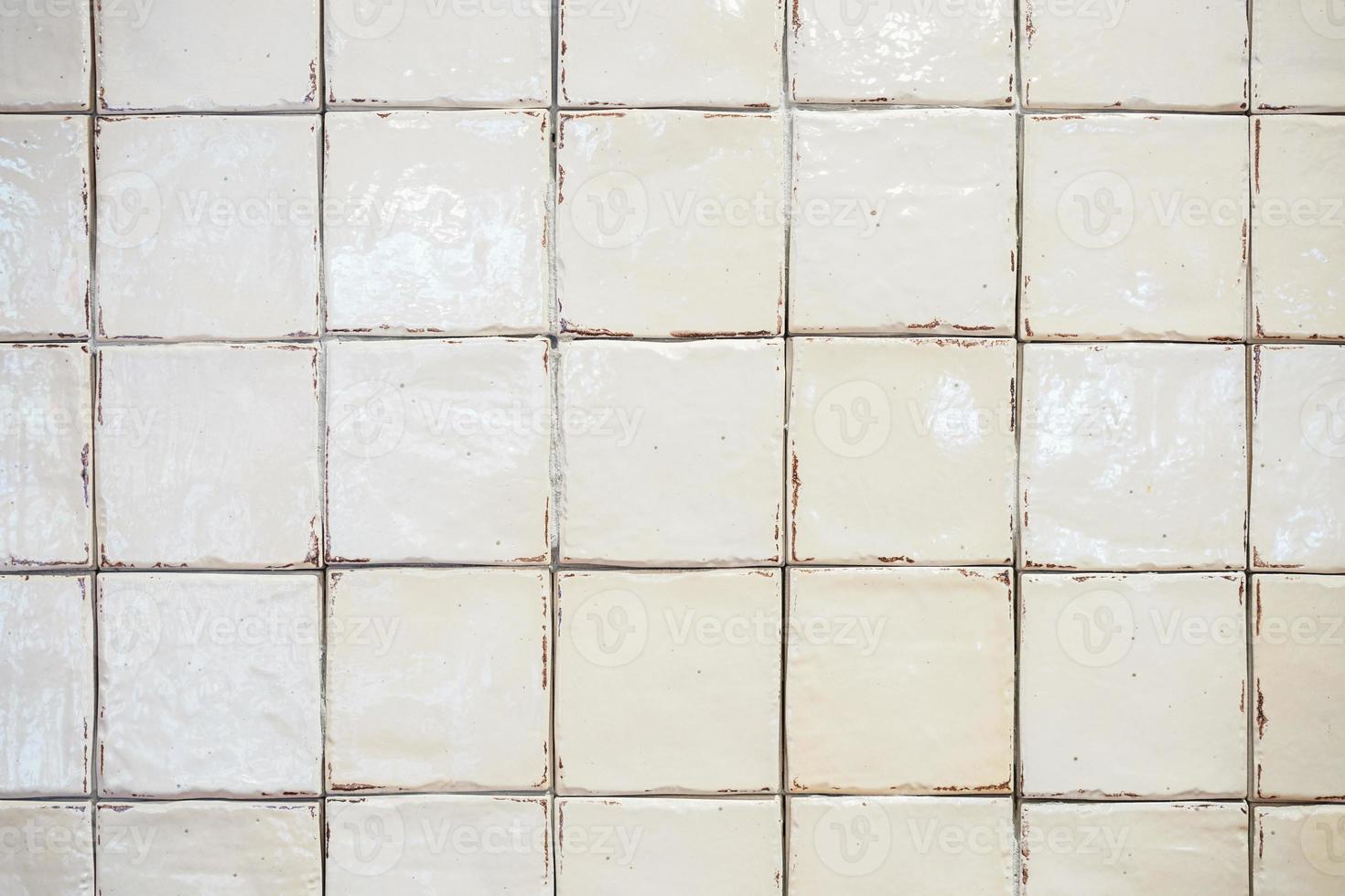 white old dirty tile wall in the bathroom did not clean yet. photo