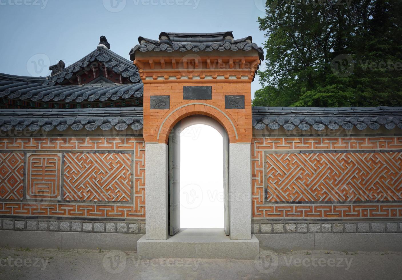 Korea Vintage Gateway and traditional vintage wall with the light inside the door. photo