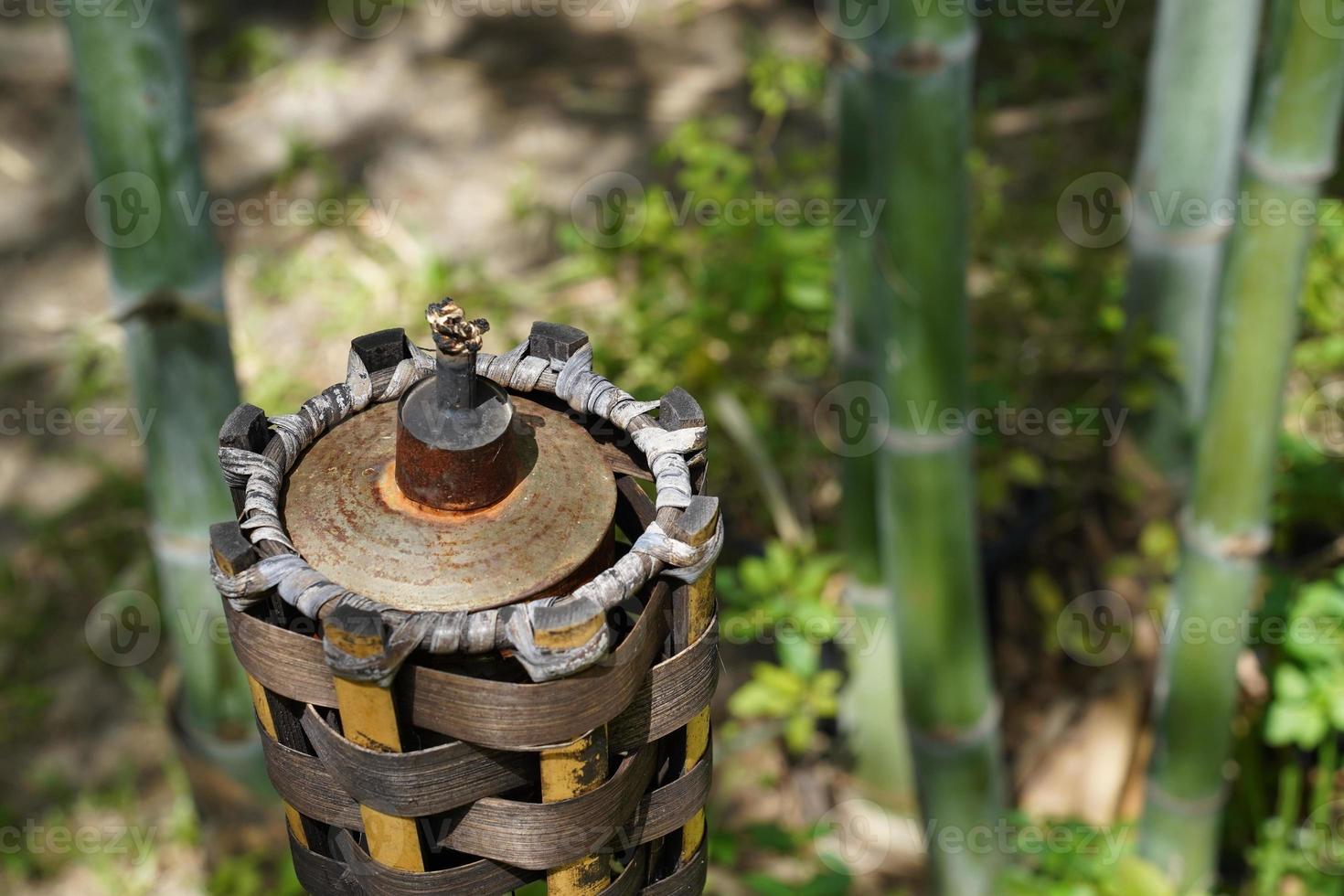 bamboo torch without fire in the garden at noon. photo