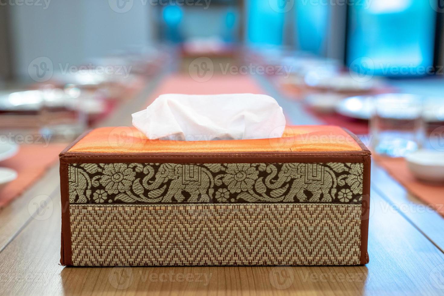 Asia Thai tissue box, elephant pattern lay on the Japanese dinner table with blur background. photo