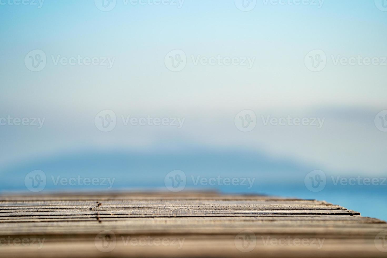 Wood Vintage Terrace on the beach with blue Sea, Ocean, Sky Background photo