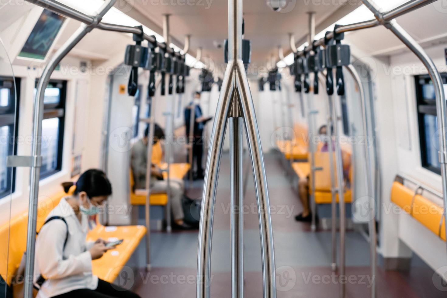 The local Thai people transports inside the train of Bangkok Mass Transit System on the midday period photo