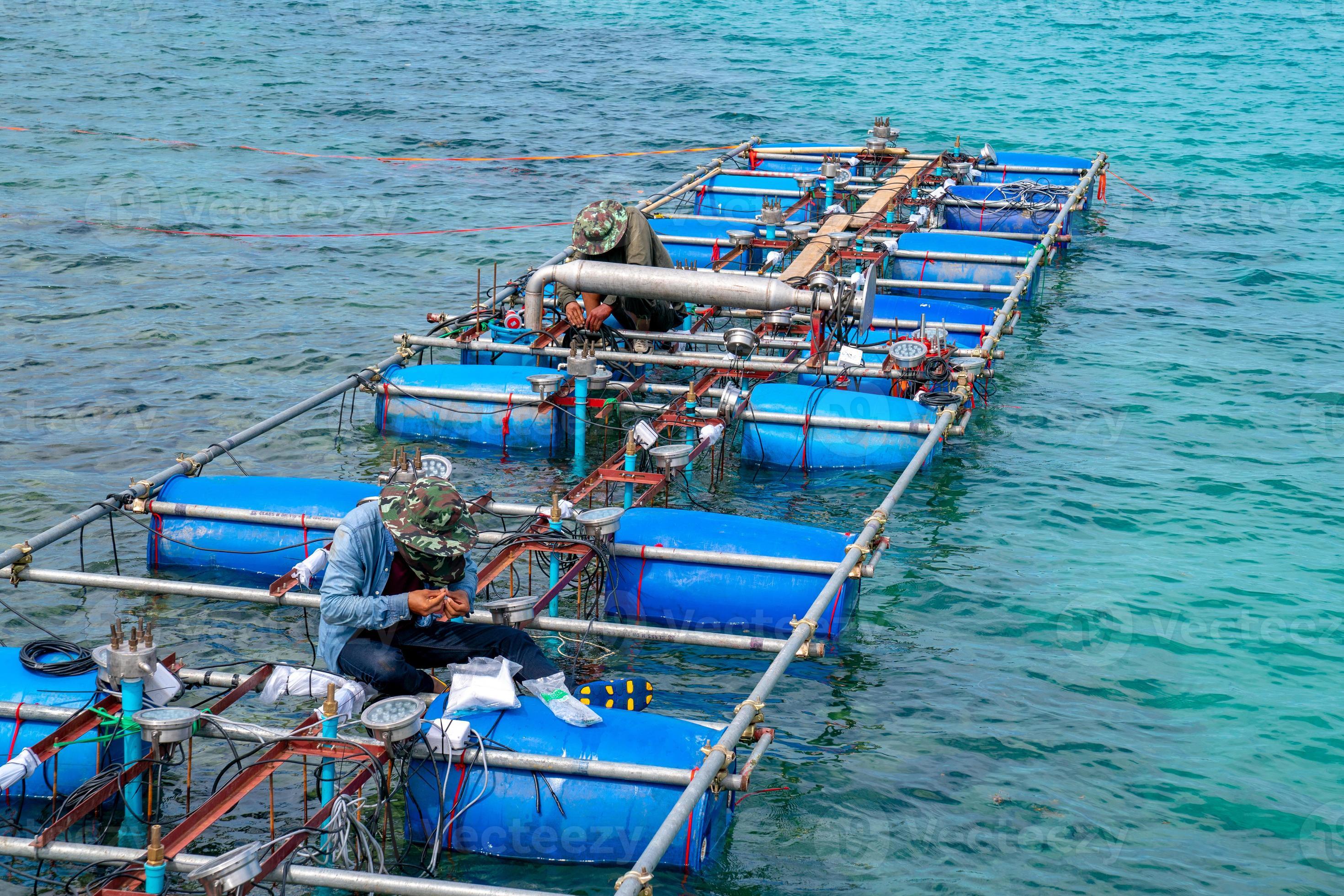 Workers settle and setup the waterworks fountain machine on the surface