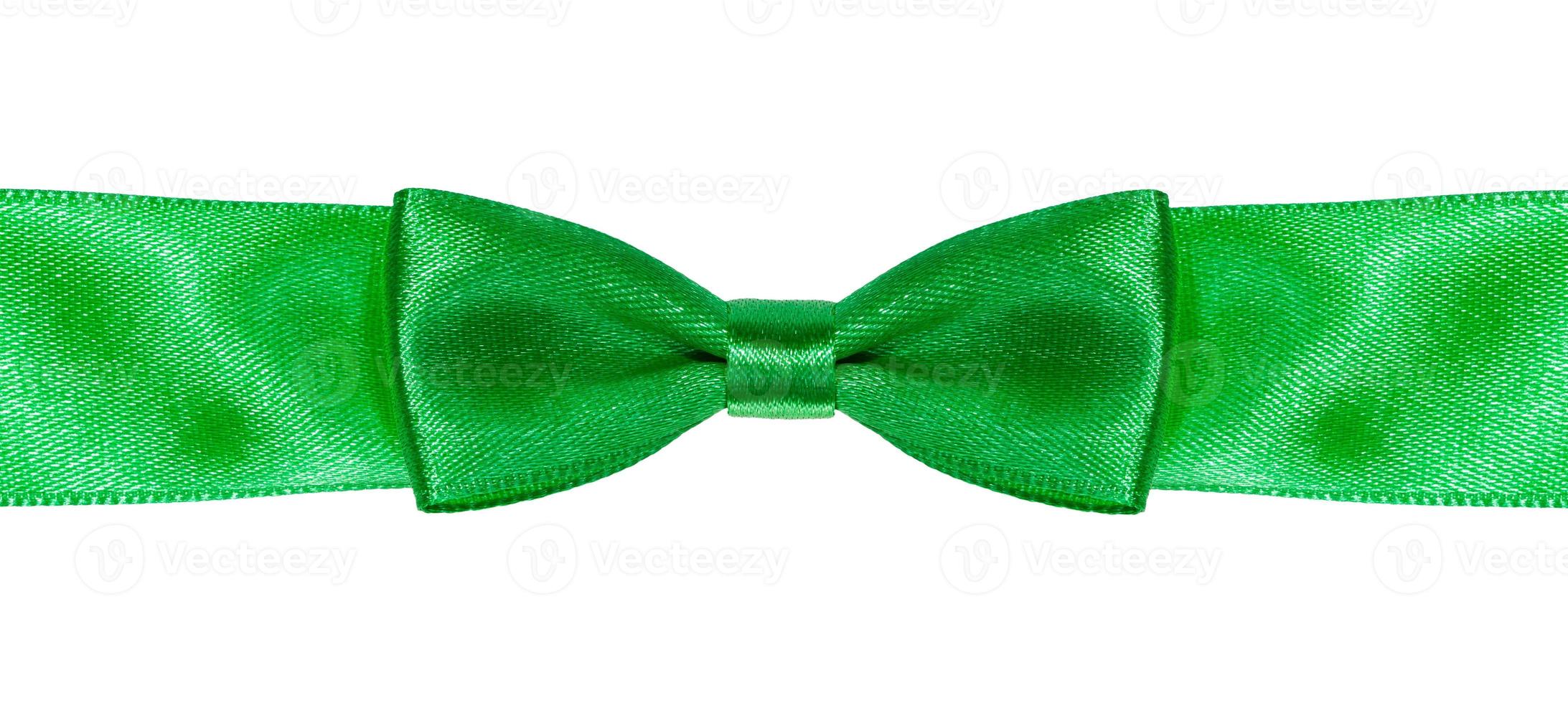 symmetric bow knot on green satin ribbon close up photo