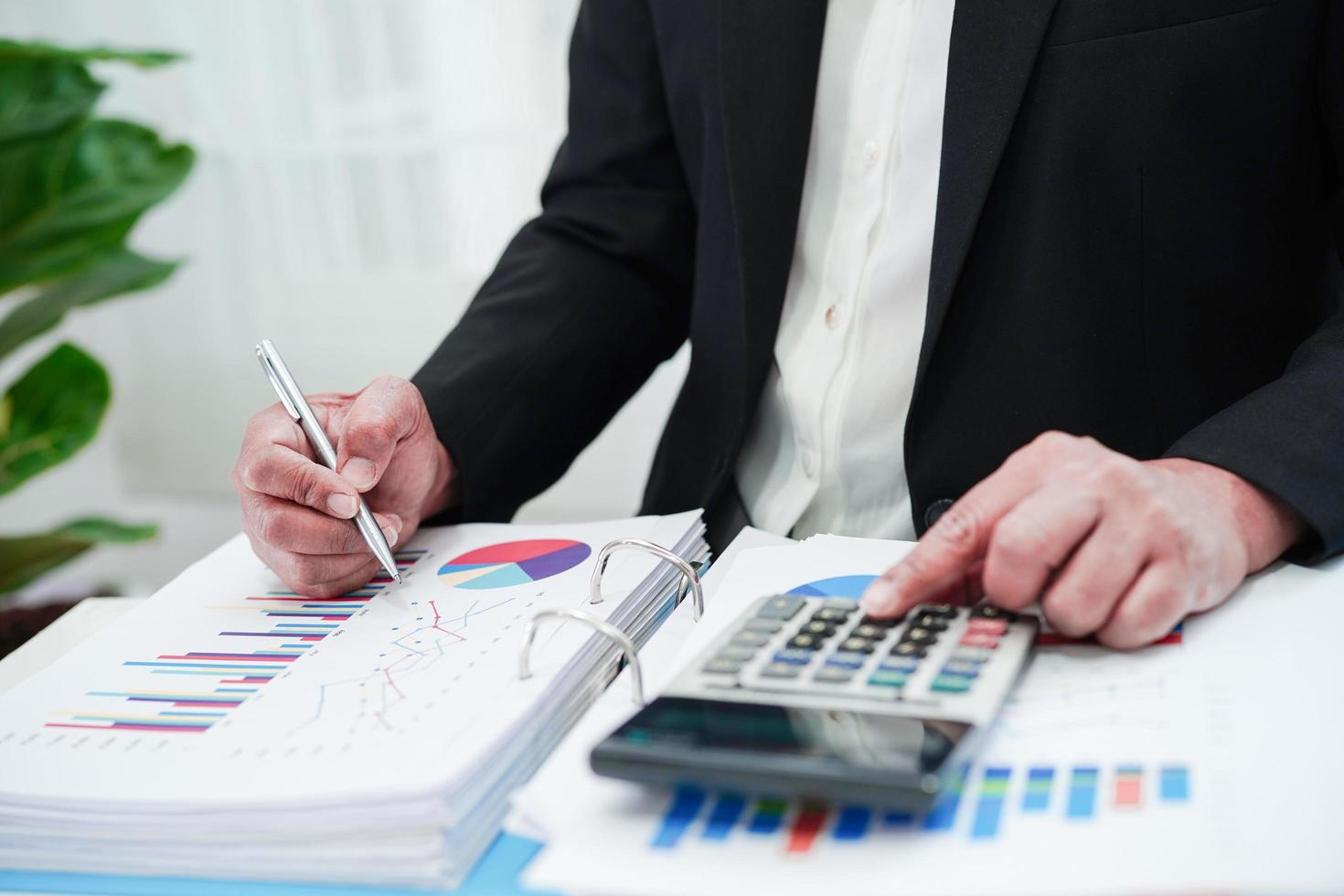 Business woman working and analysis with statistic graph in office. photo