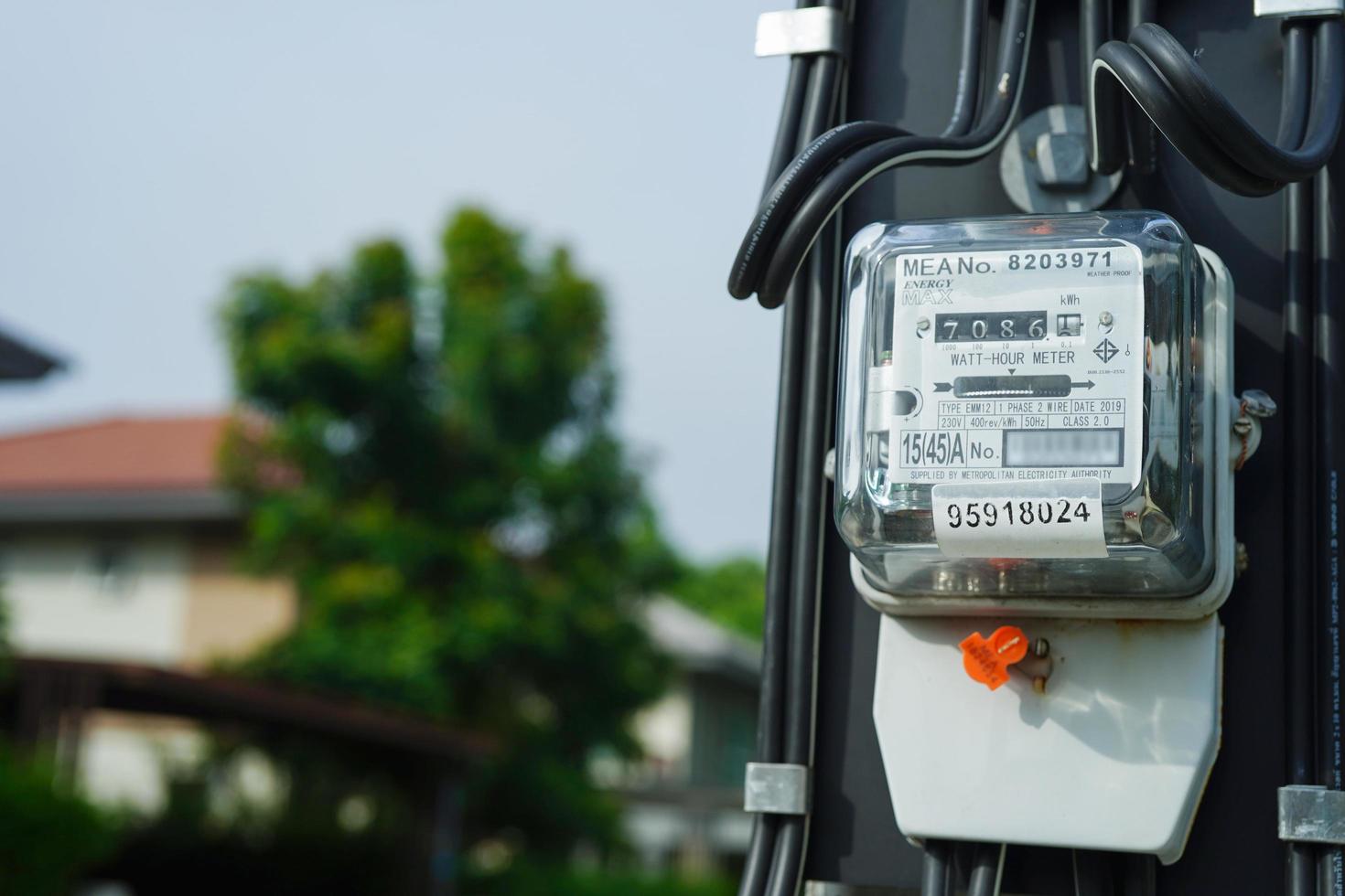 Bangkok, Thailand - May 15, 2022 Electric measuring power meter for energy cost at home and office. photo