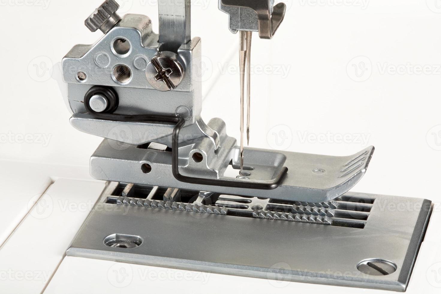 needles and foot of sewing machine photo