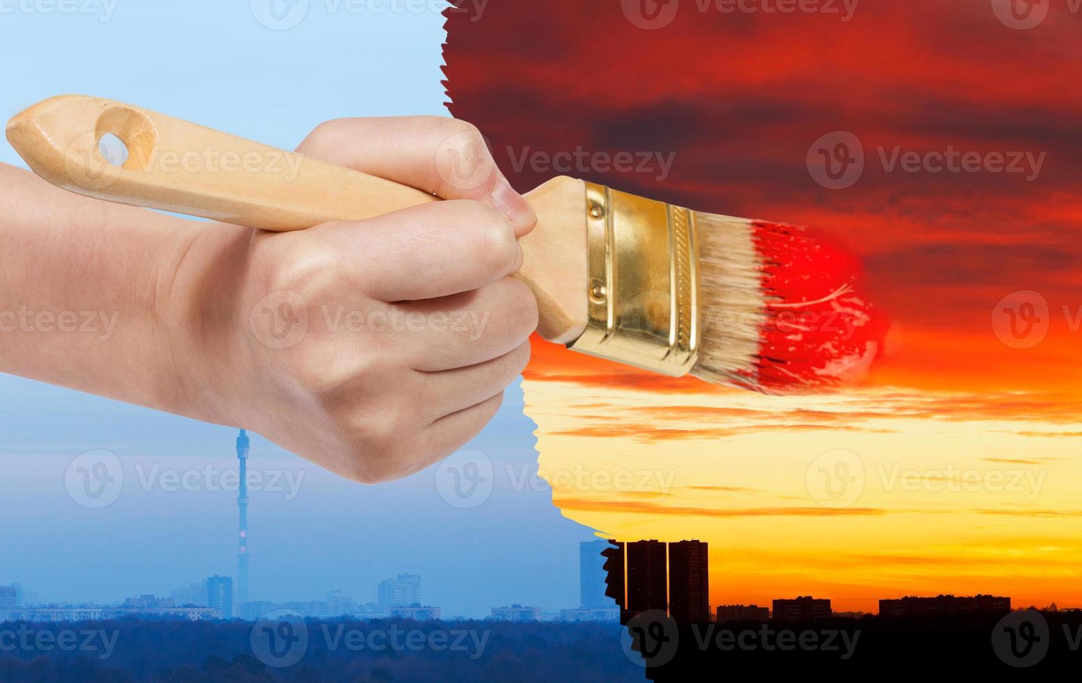 paintbrush paints red sunset on blue sunrise photo