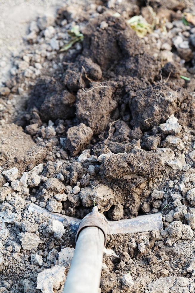 digging a hole by shovel close up photo