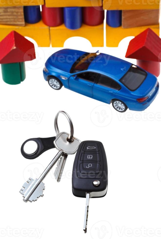 door, vehicle keys, blue car model and block house photo