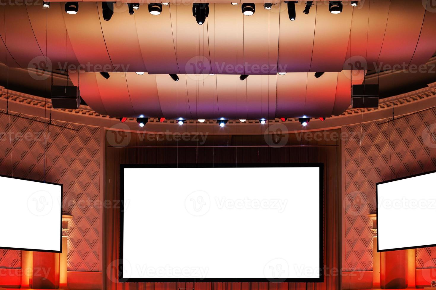 screens in red and brown illuminated cinema photo