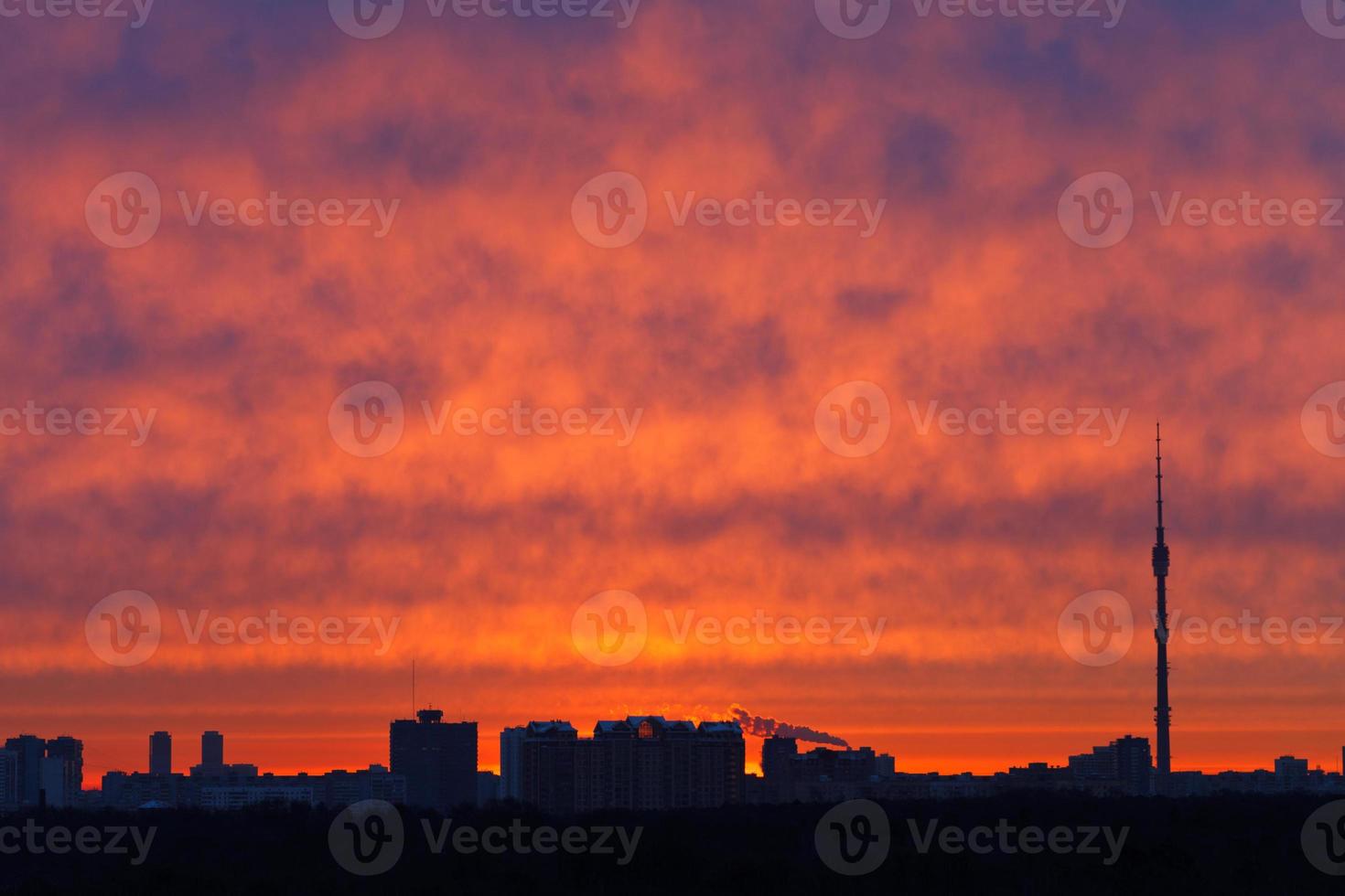 red clouds over city in spring photo