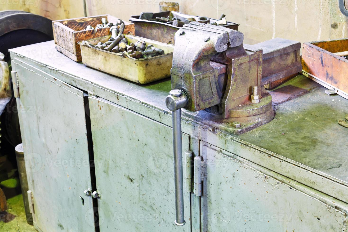 vice on table in locksmith workshop photo