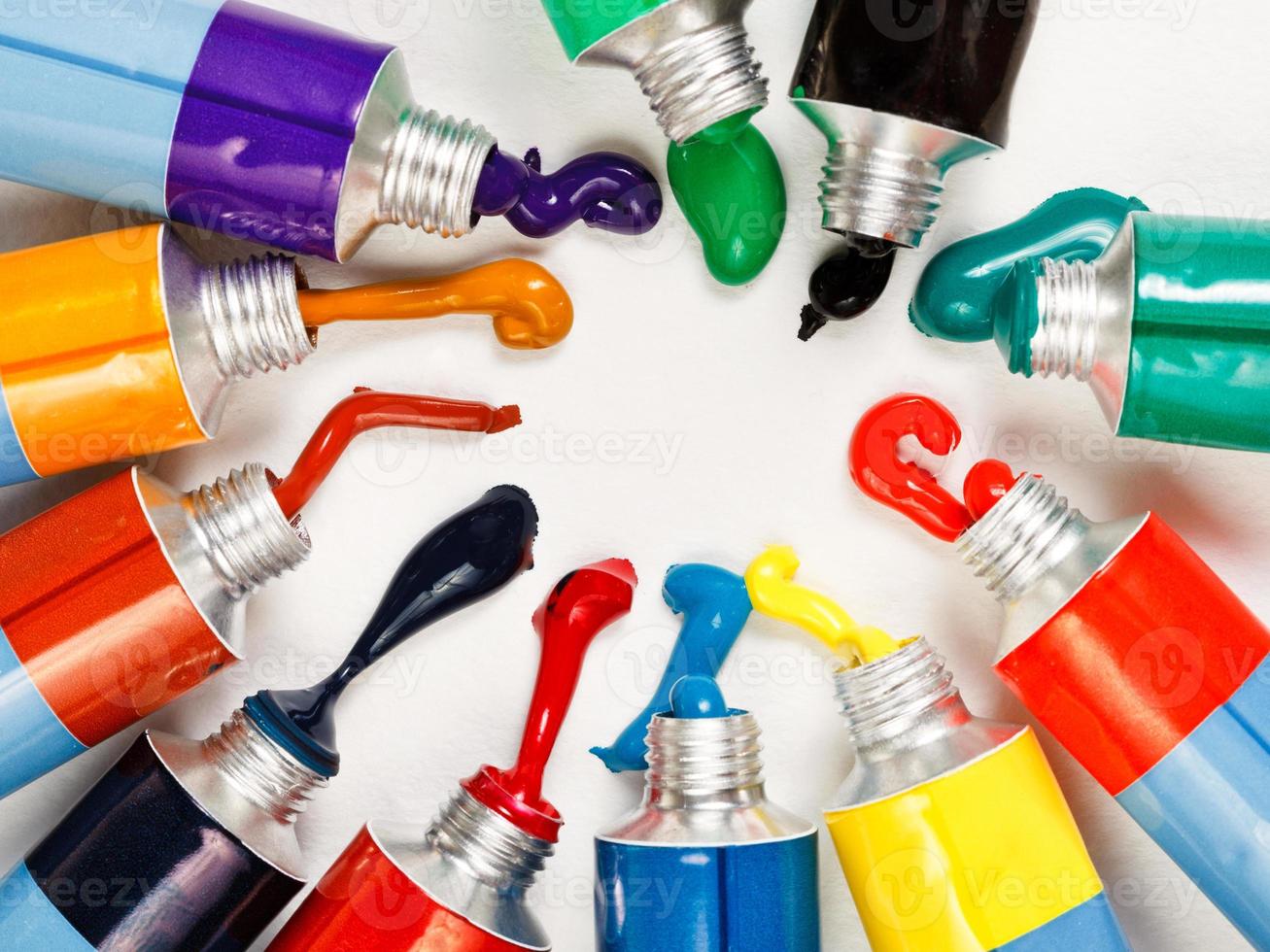 multicolored tubes with squeezed watercolors photo