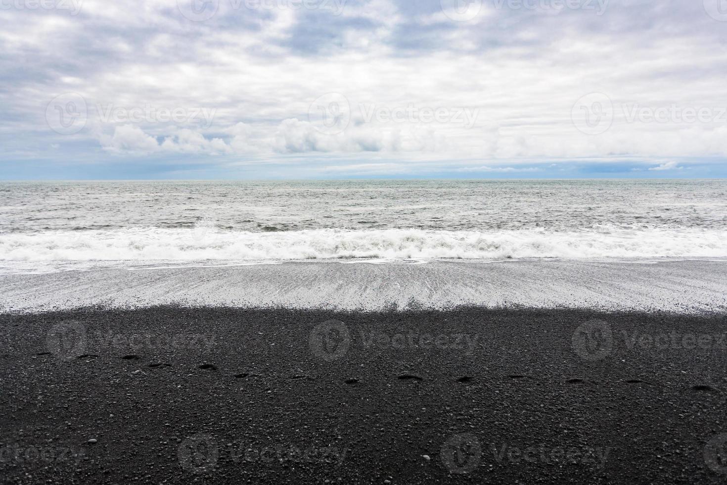 ocean waves on Reynisfjara black Beach in Iceland photo