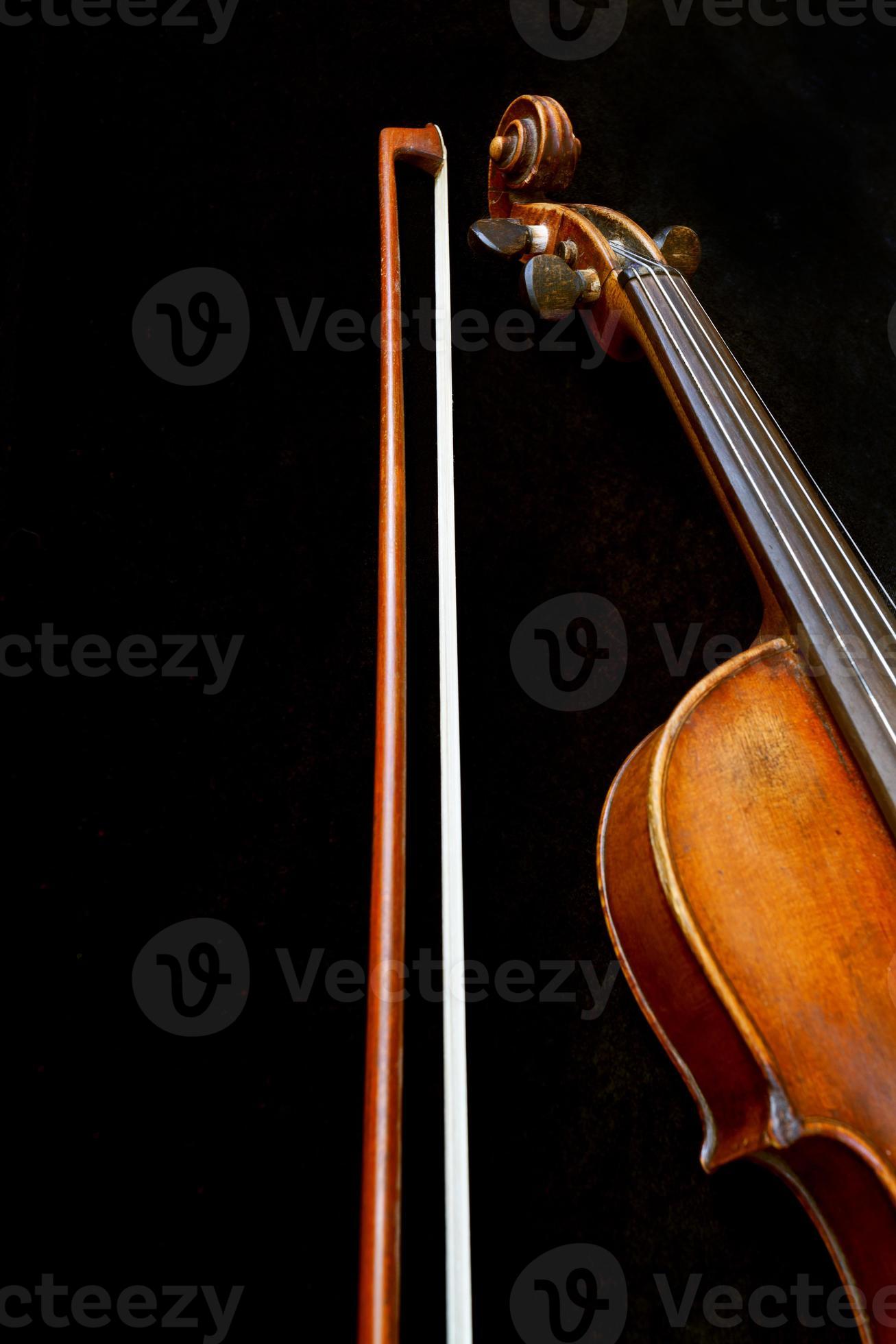 violin neck and bow on black 11688724 Stock Photo at Vecteezy