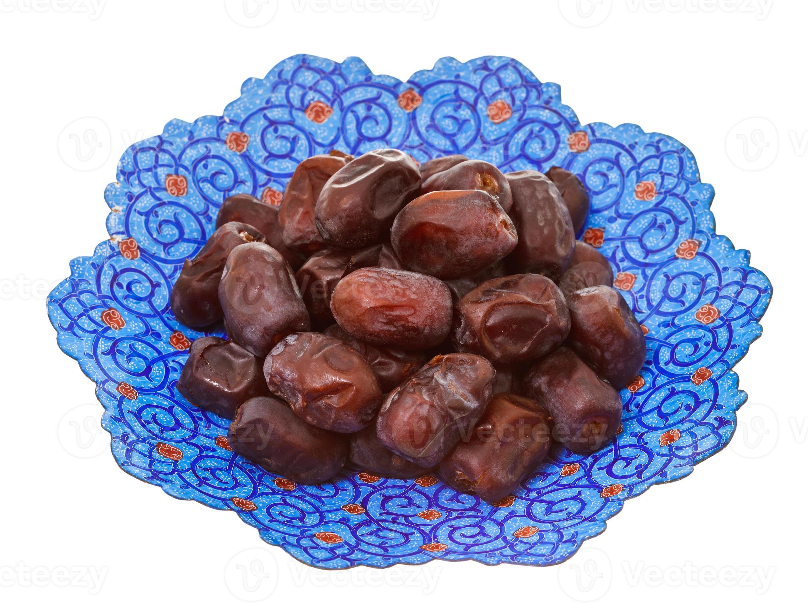 dried dates on iranian plate 11688758 Stock Photo at Vecteezy