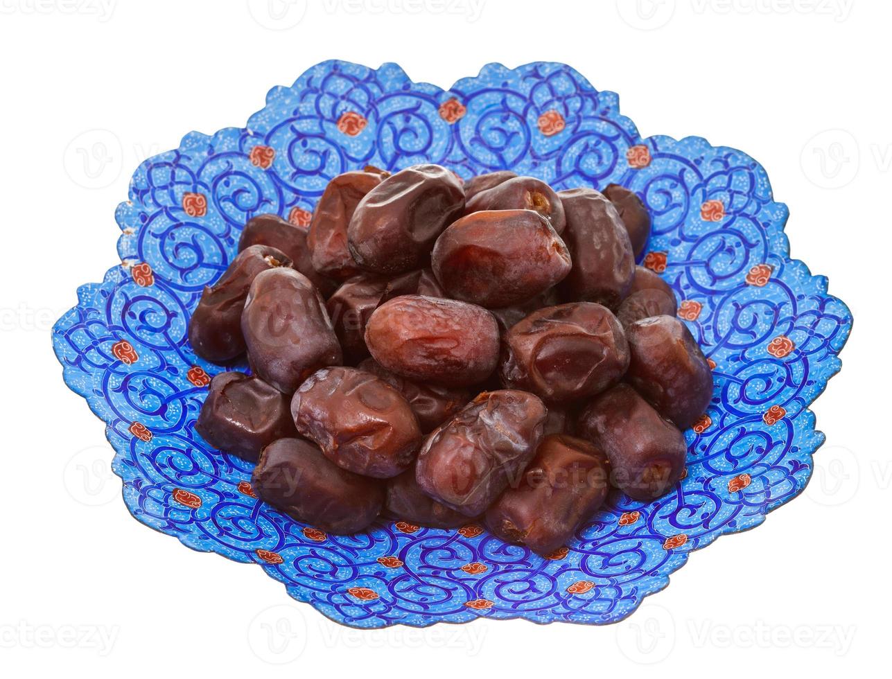 dried dates on iranian plate 11688758 Stock Photo at Vecteezy