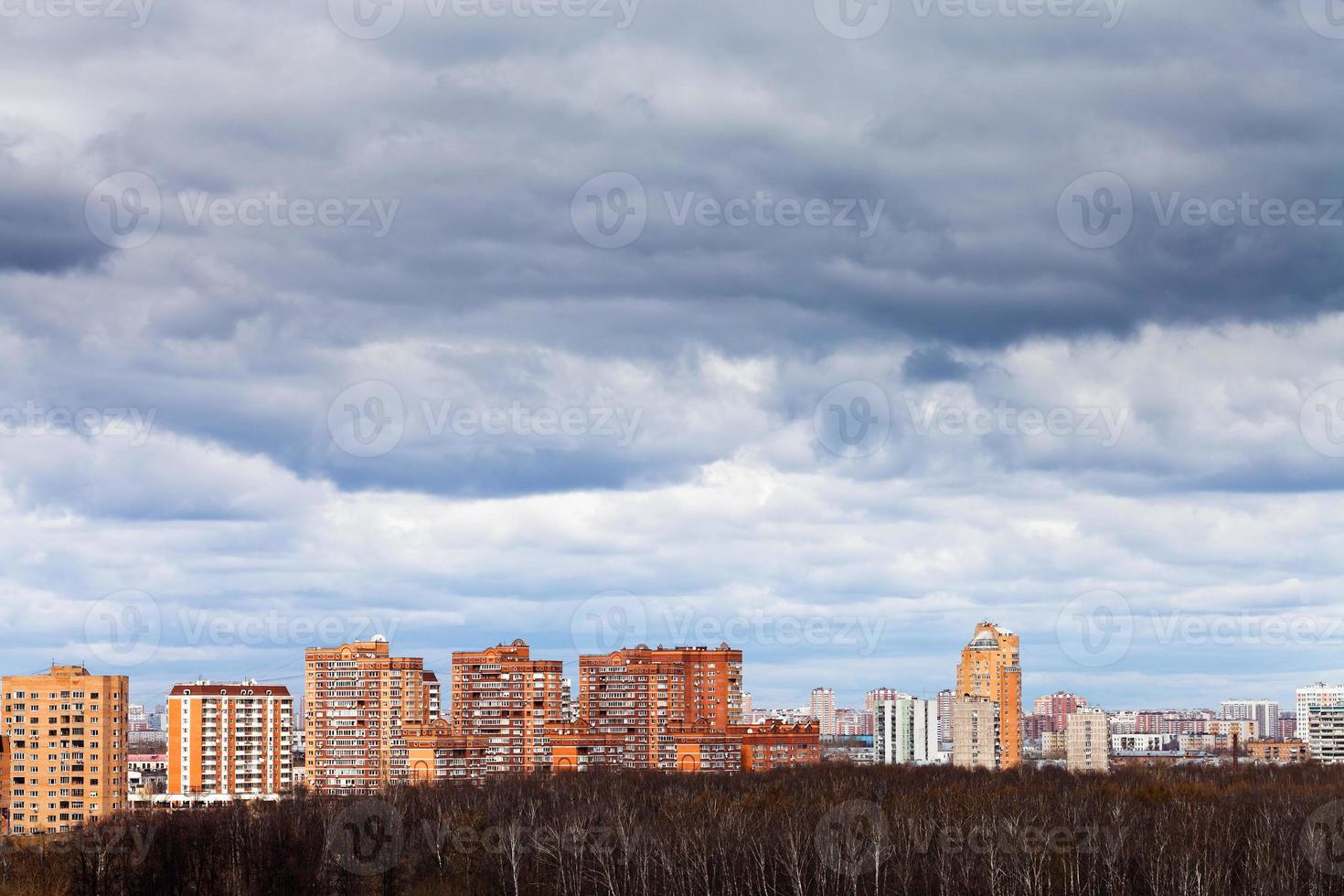 rainy clouds under urban houses photo