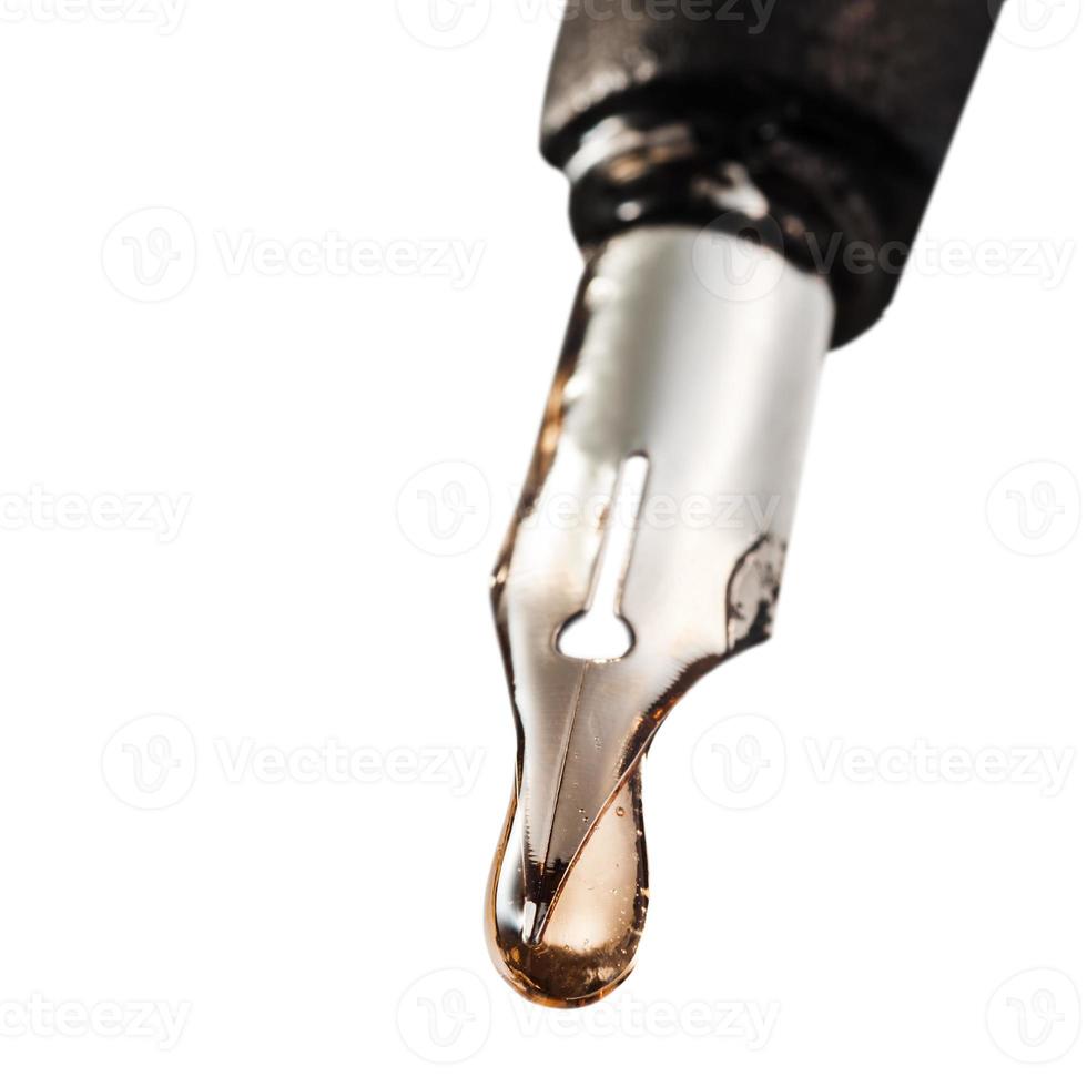 drop of transparent poison on tip of pen photo
