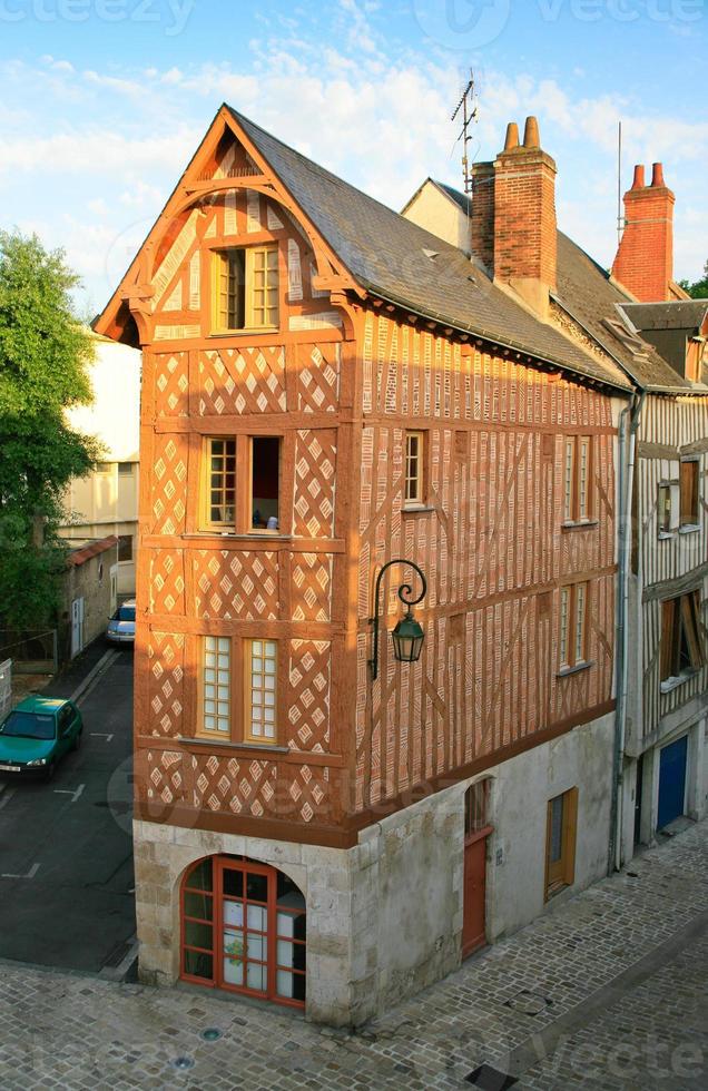 old narrow corner timber framing house photo