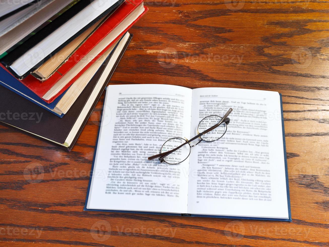 open book on wooden table photo