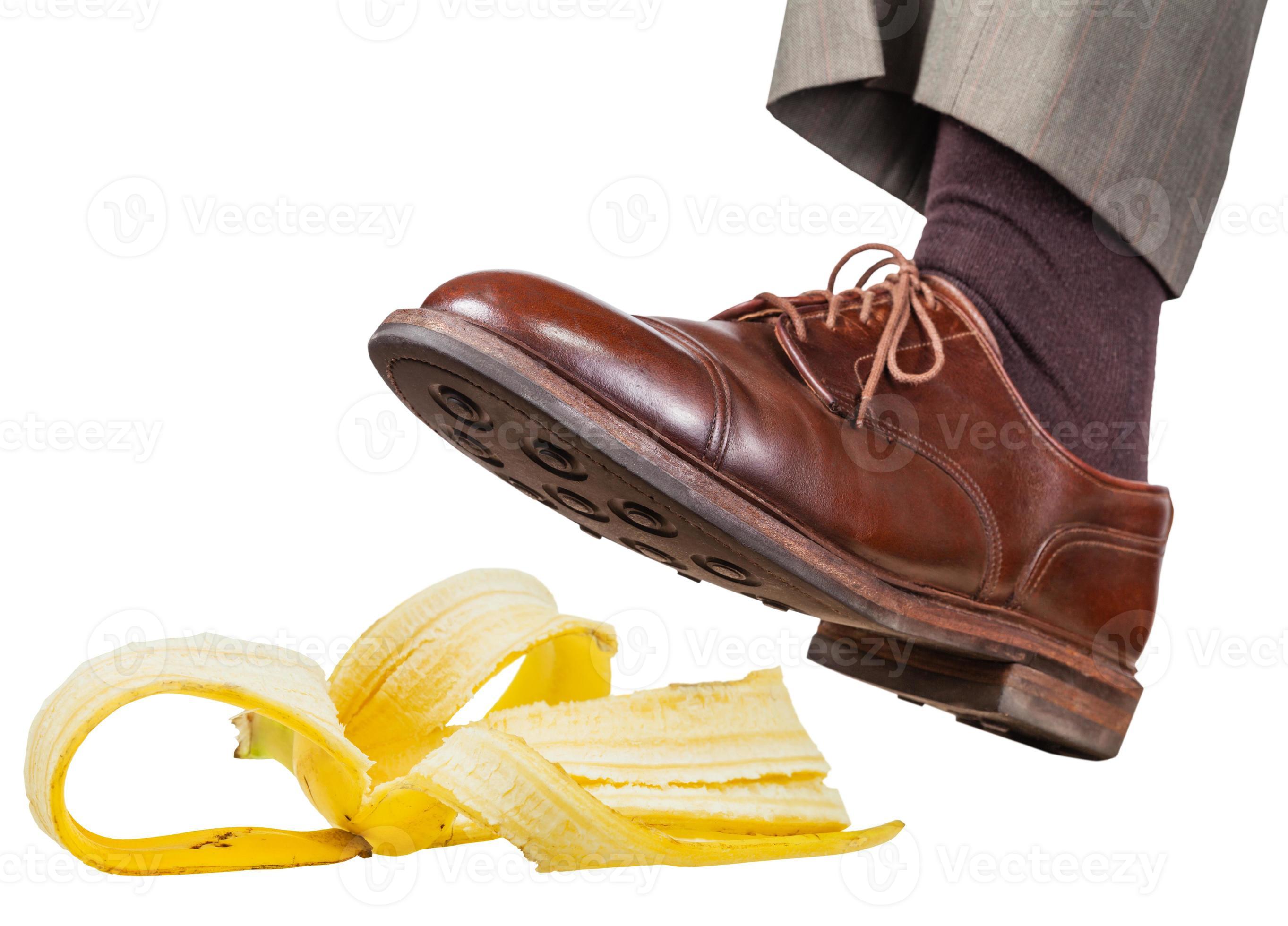 foot in the left brown shoe slips on a banana peel 11689401 Stock Photo at Vecteezy