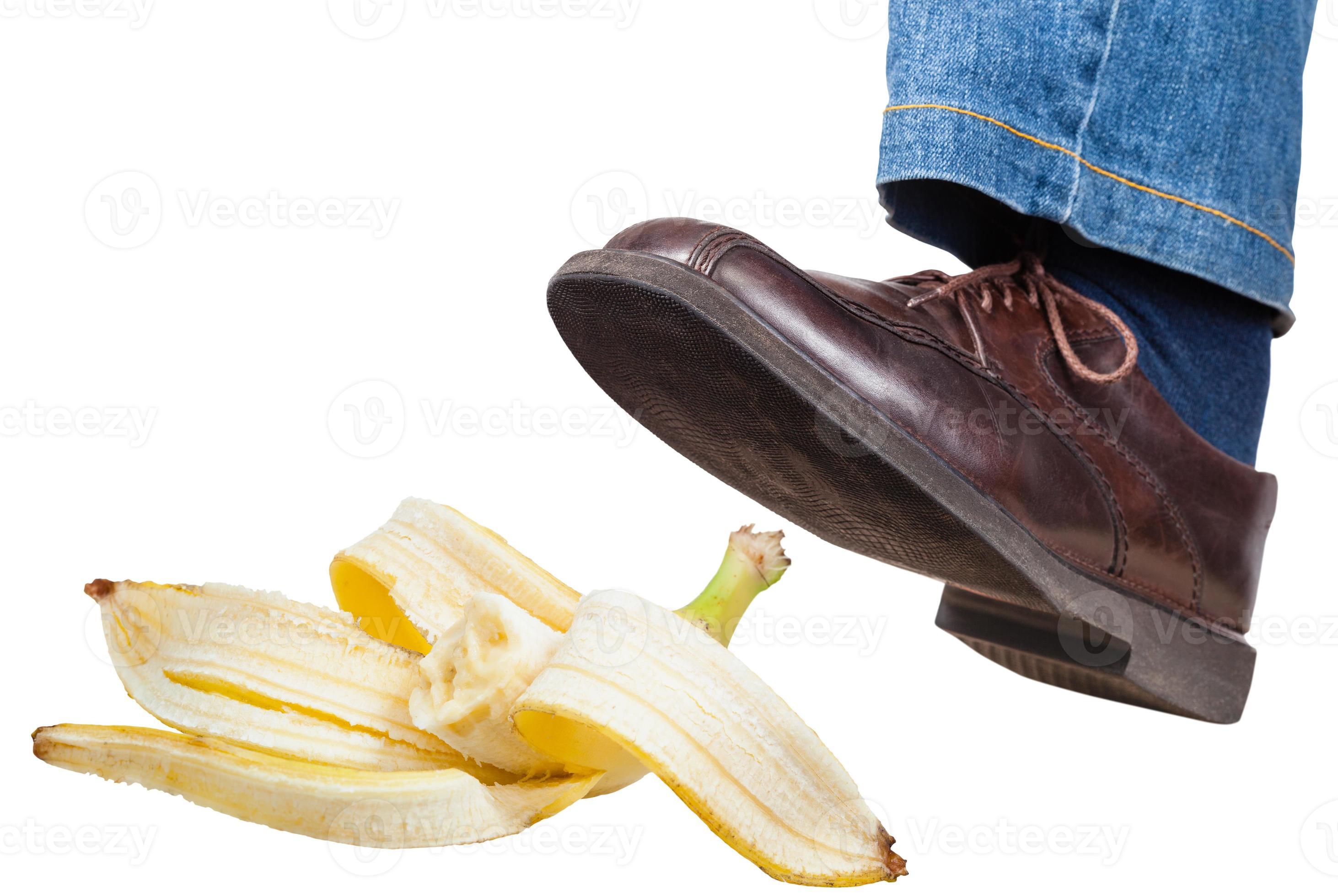 left foot in jeans and shoe slips on banana peel 11689497 Stock Photo at Vecteezy