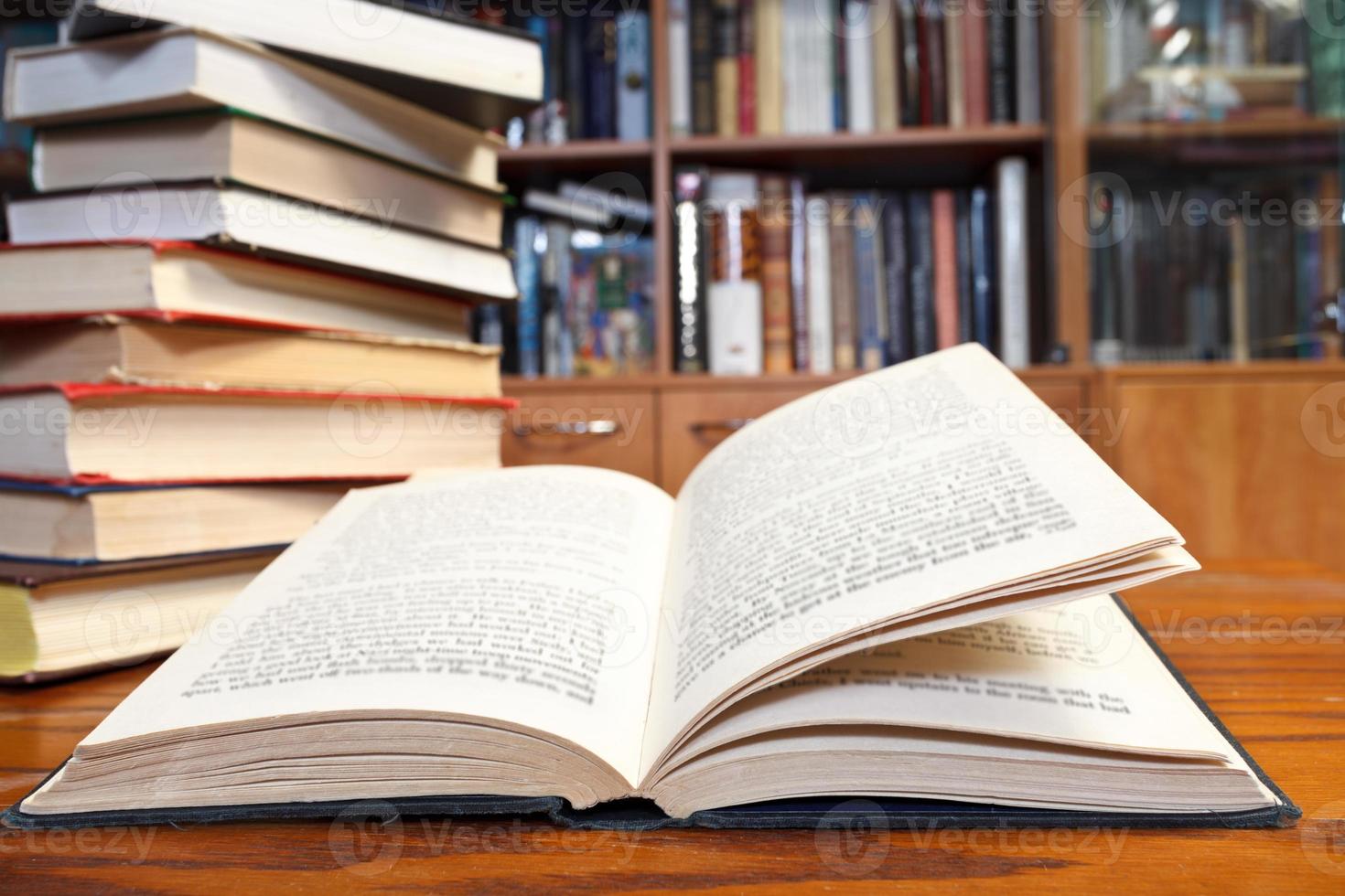 open book on wooden table photo