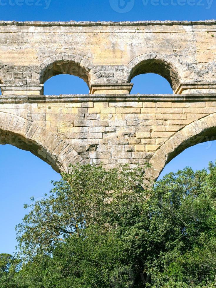 arch of ancient Roman aqueduct Pont du Gard photo