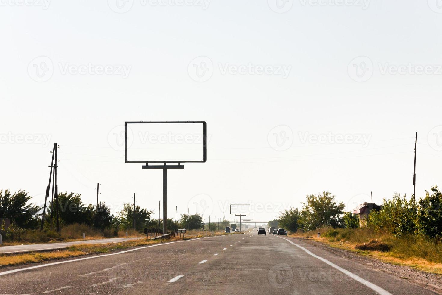 empty roadside billboards along highway photo