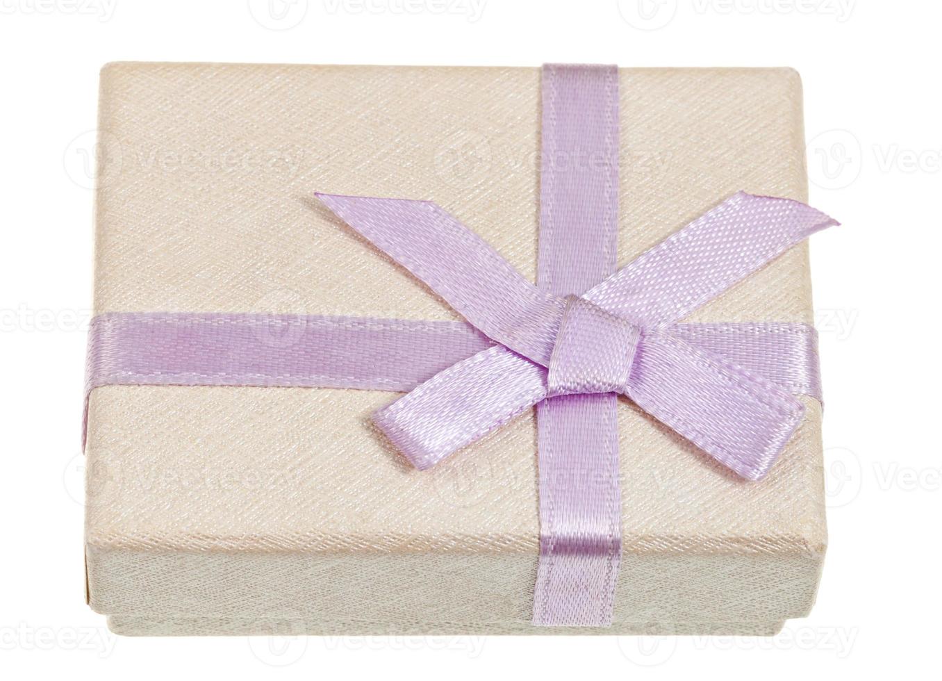 small shining gift box with pink bow photo