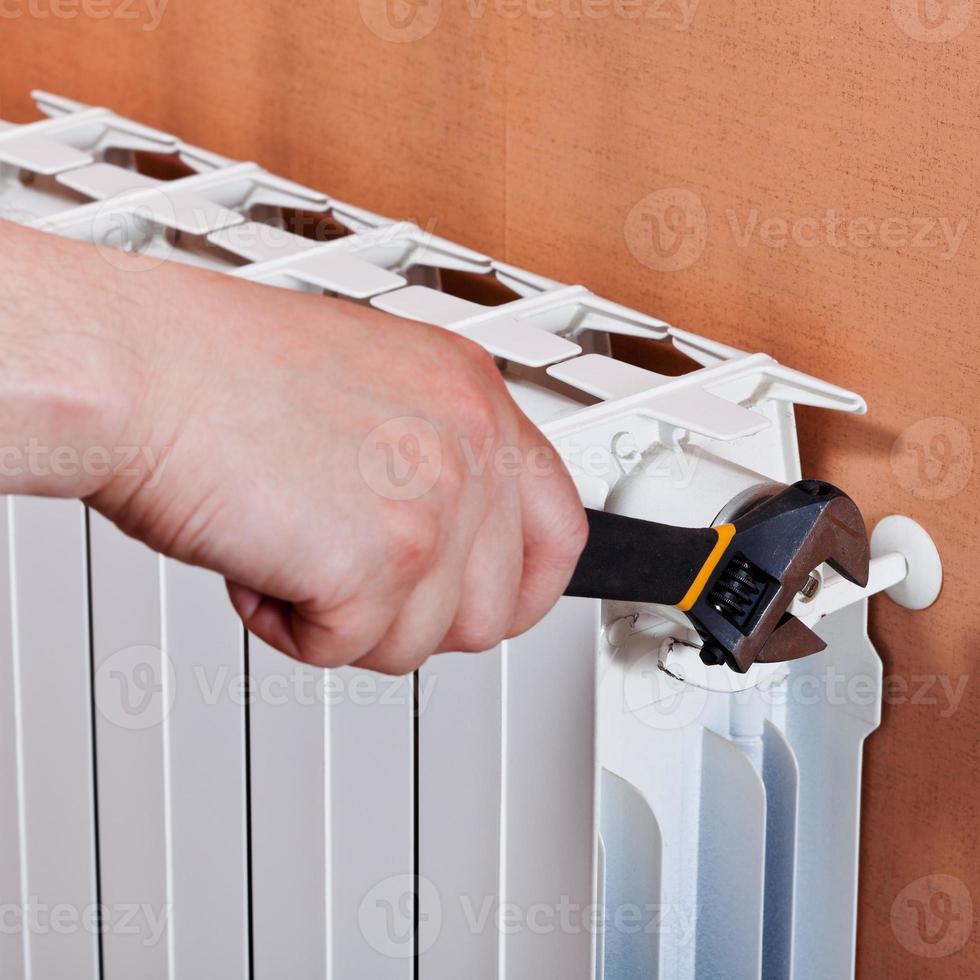 adjusting heating radiator photo