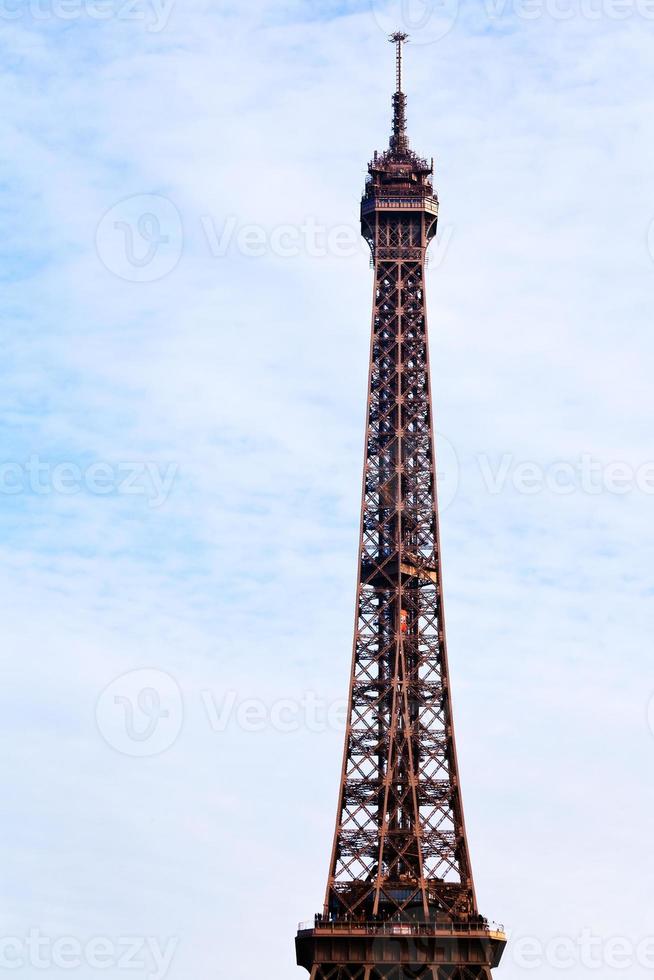 Eiffel tower with blue sky and white clouds in Paris photo