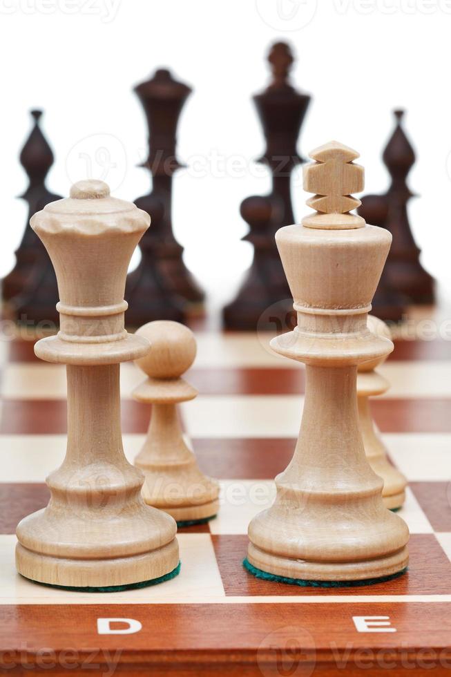 view of set of chess pieces from king and queen photo