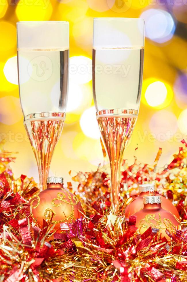 glasses, gold Xmass balls on blurry background 9 photo