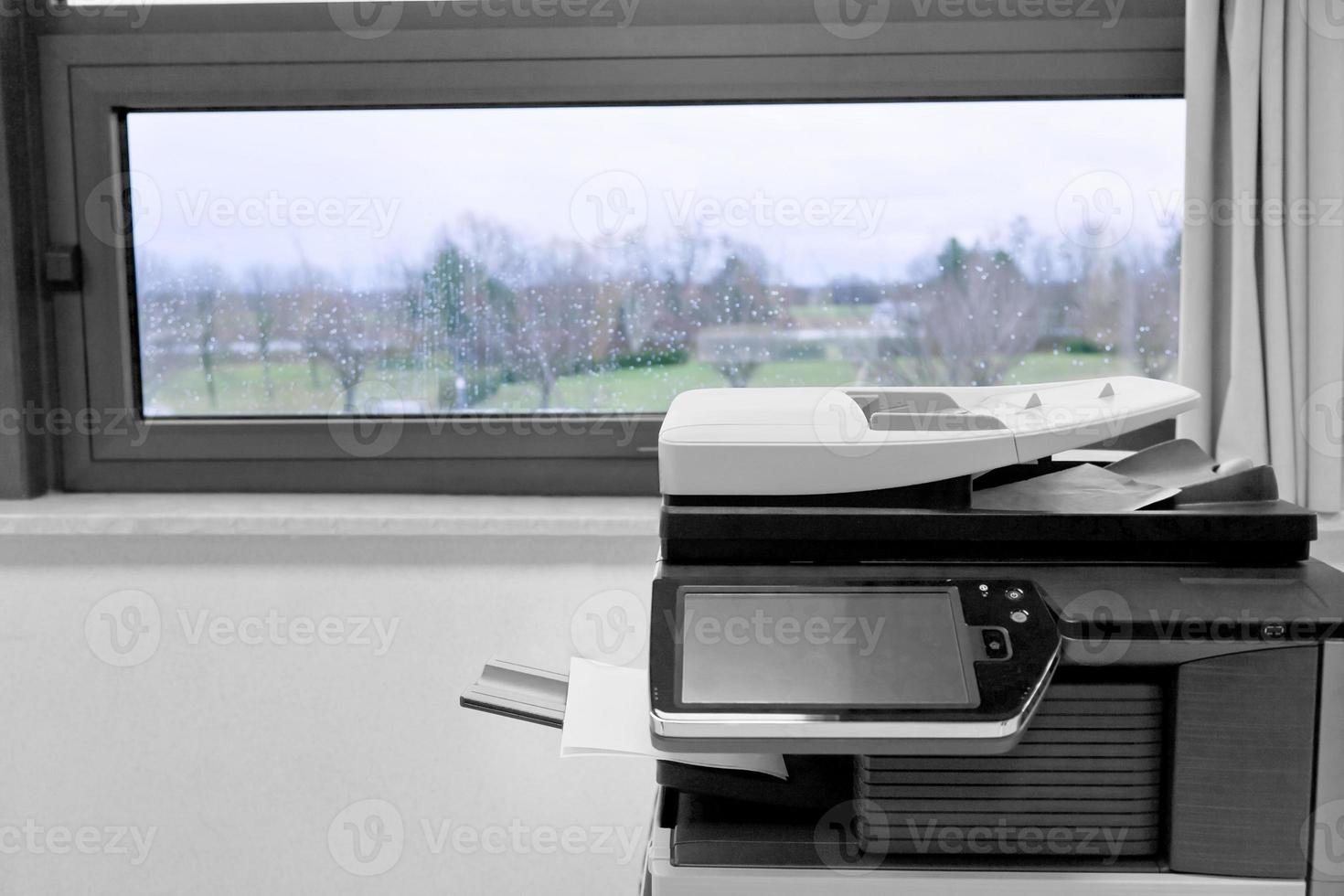 big grey copier in grey office photo