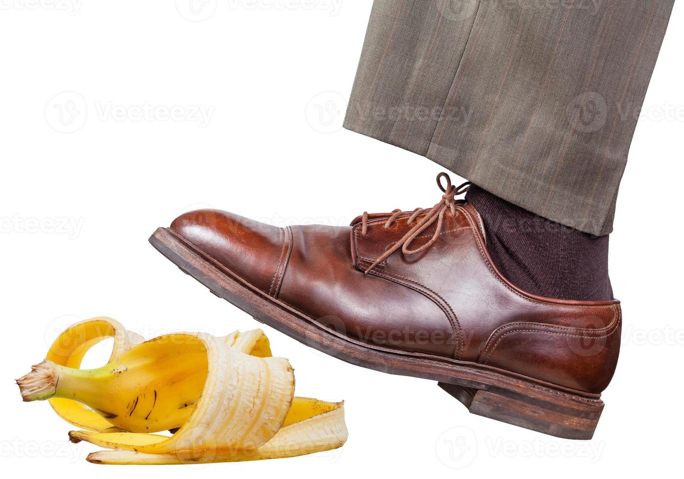 leg in the left brown shoe slips on a banana peel photo