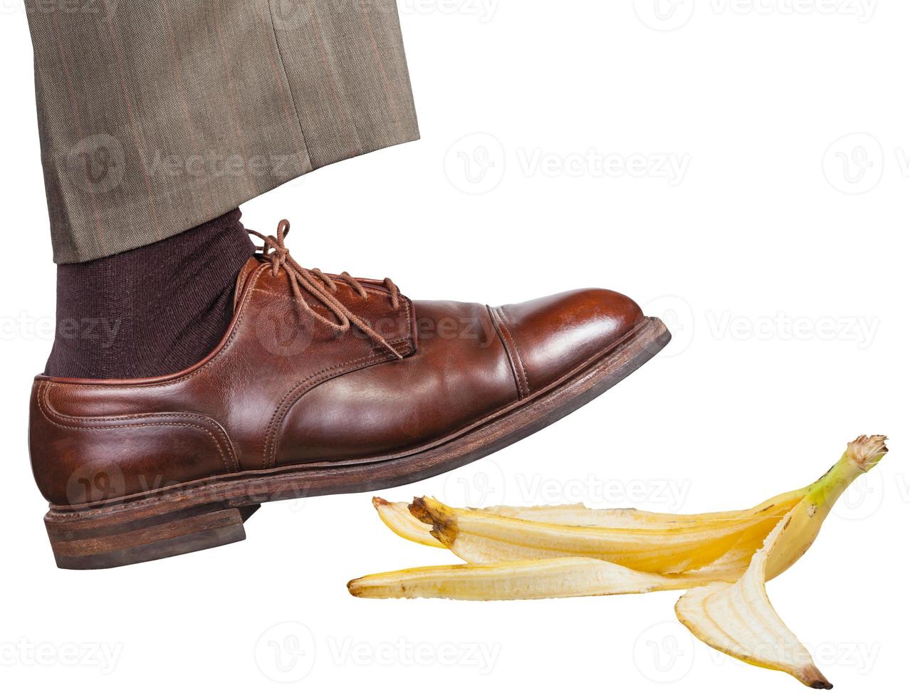 leg in the right brown shoe slips on a banana peel photo