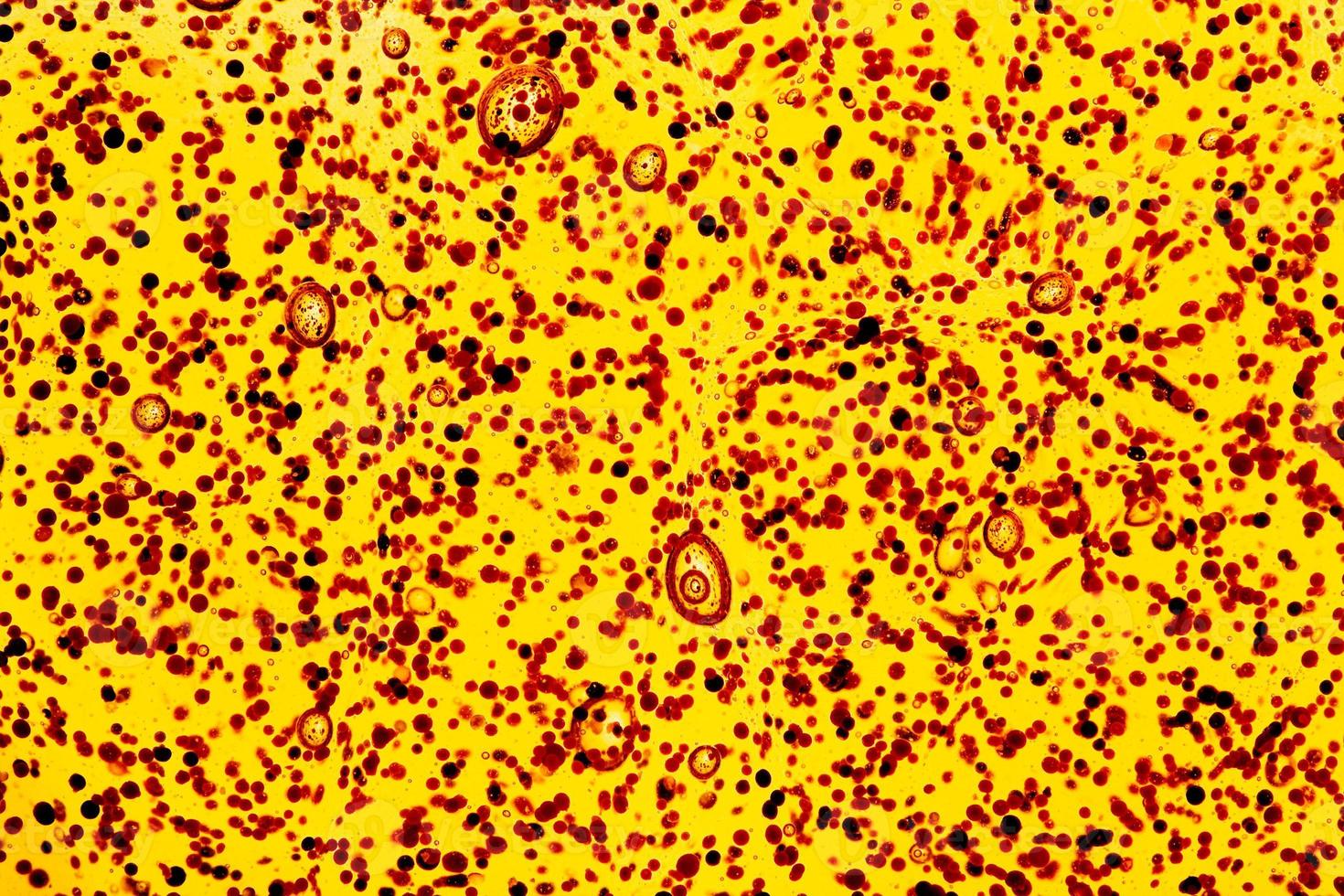 suspension of bits and air-cells in viscous liquid close-up photo