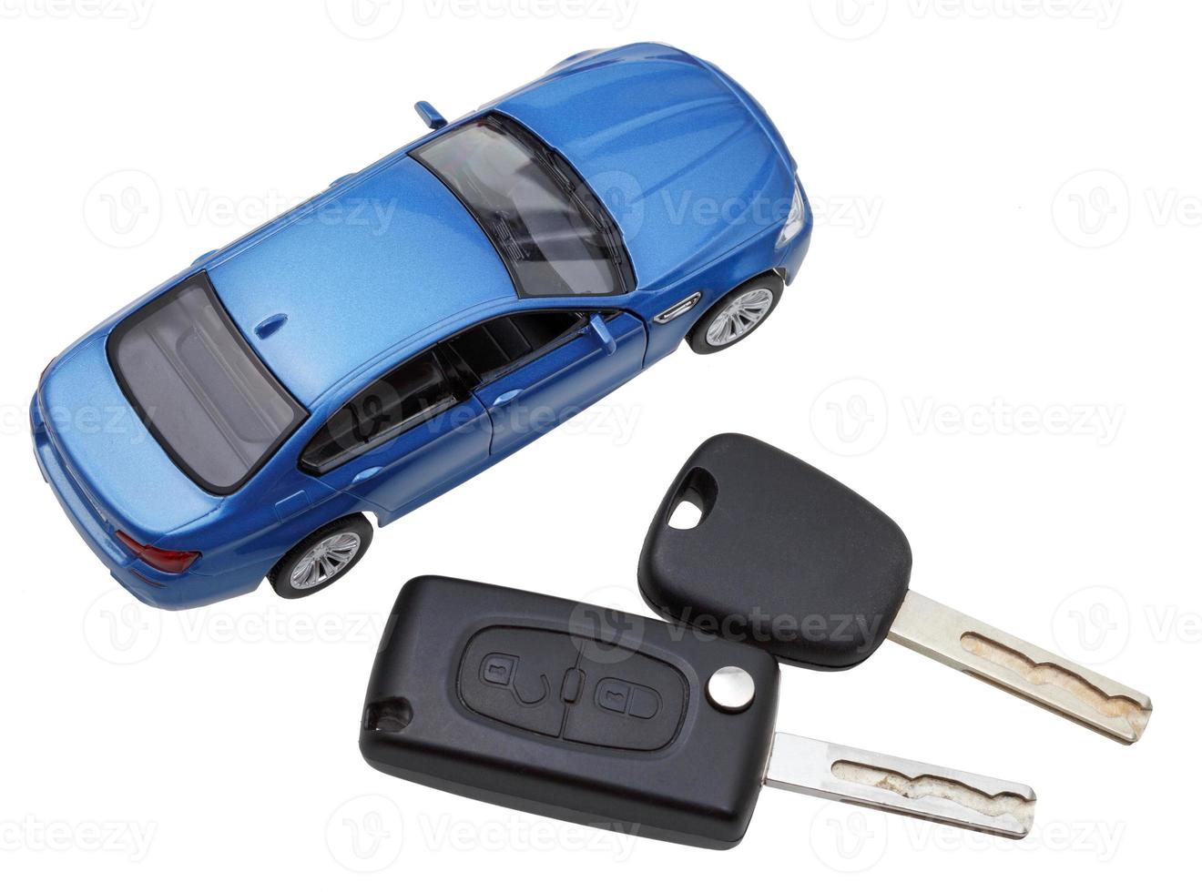 above view of two vehicle keys and model car photo
