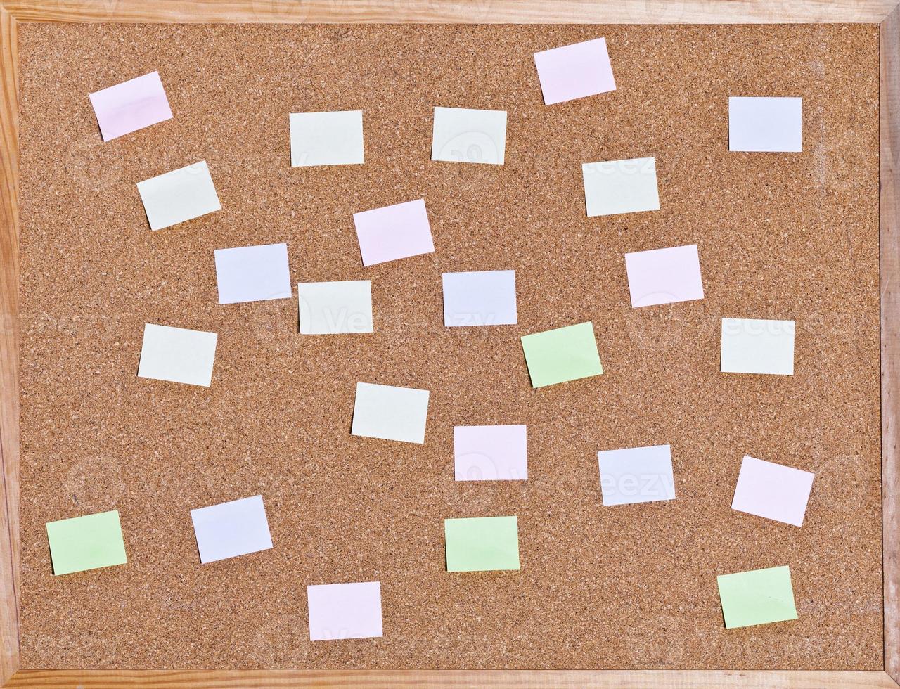 memo sticks on on cork board photo