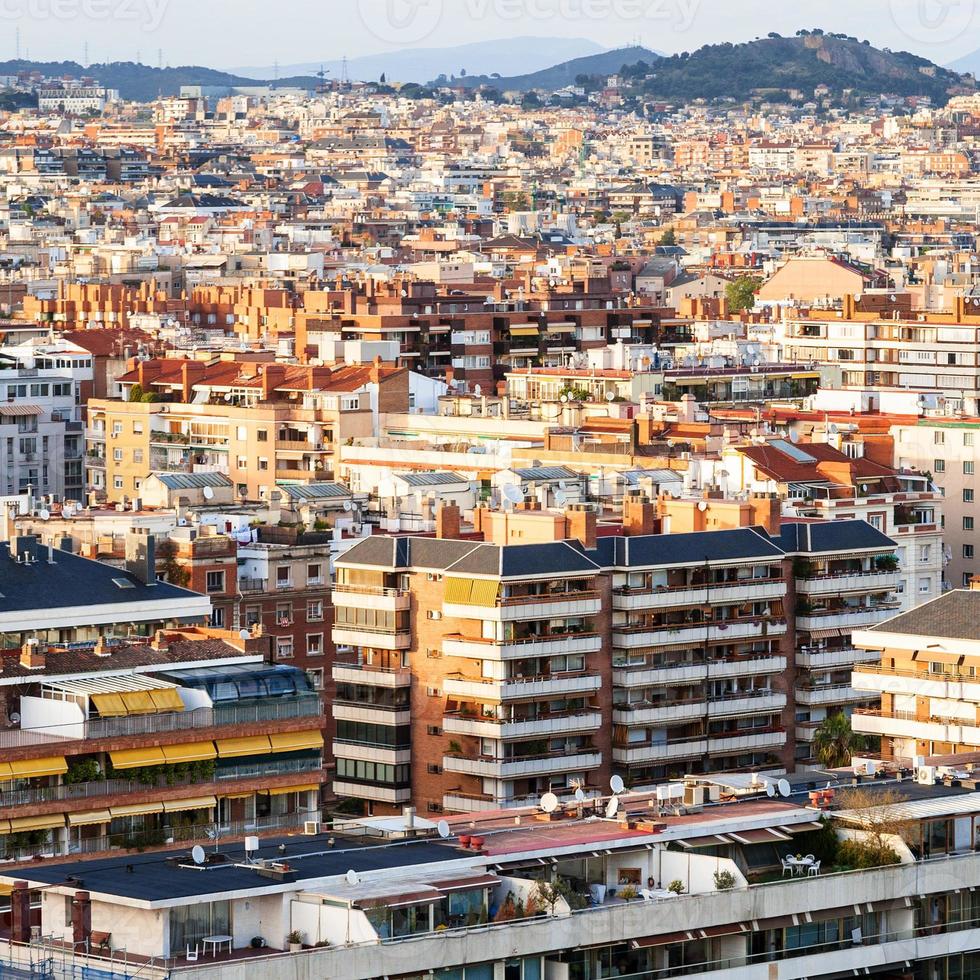 apartment houses in Barcelona city on sunset photo