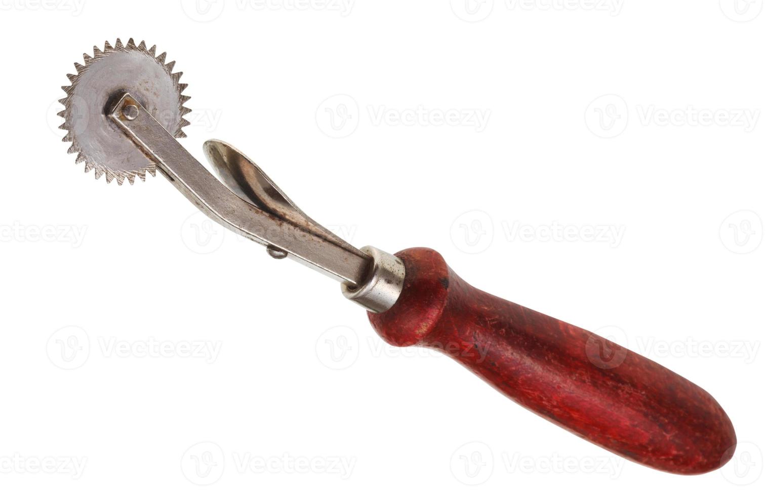 tracing wheel with red wooden handle isolated photo