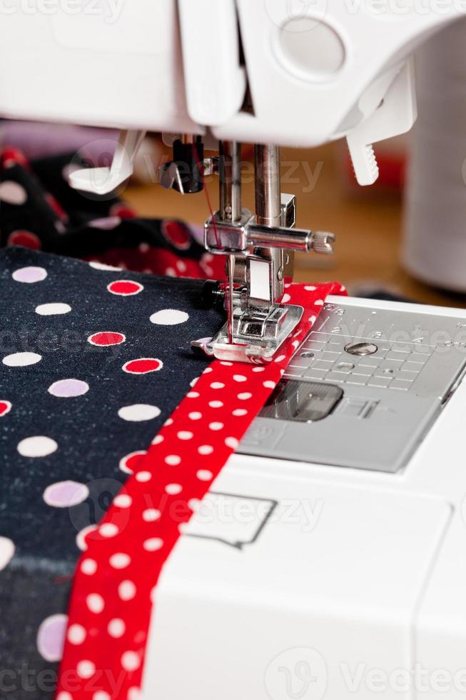 sewing dress on machine photo